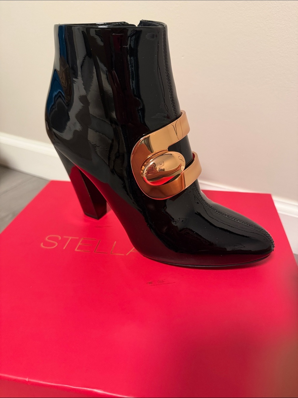 Stella Luna Black Patent Ankle Booties with Gold Accent